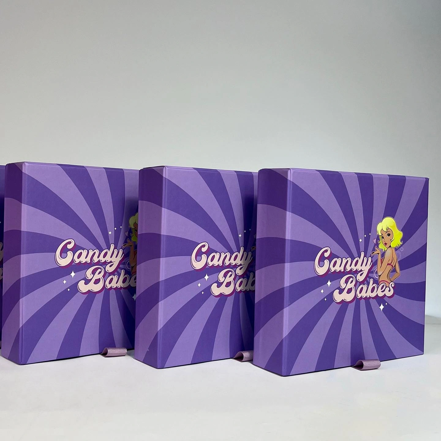 Фіолетові висувні коробки з лого Candy Babes