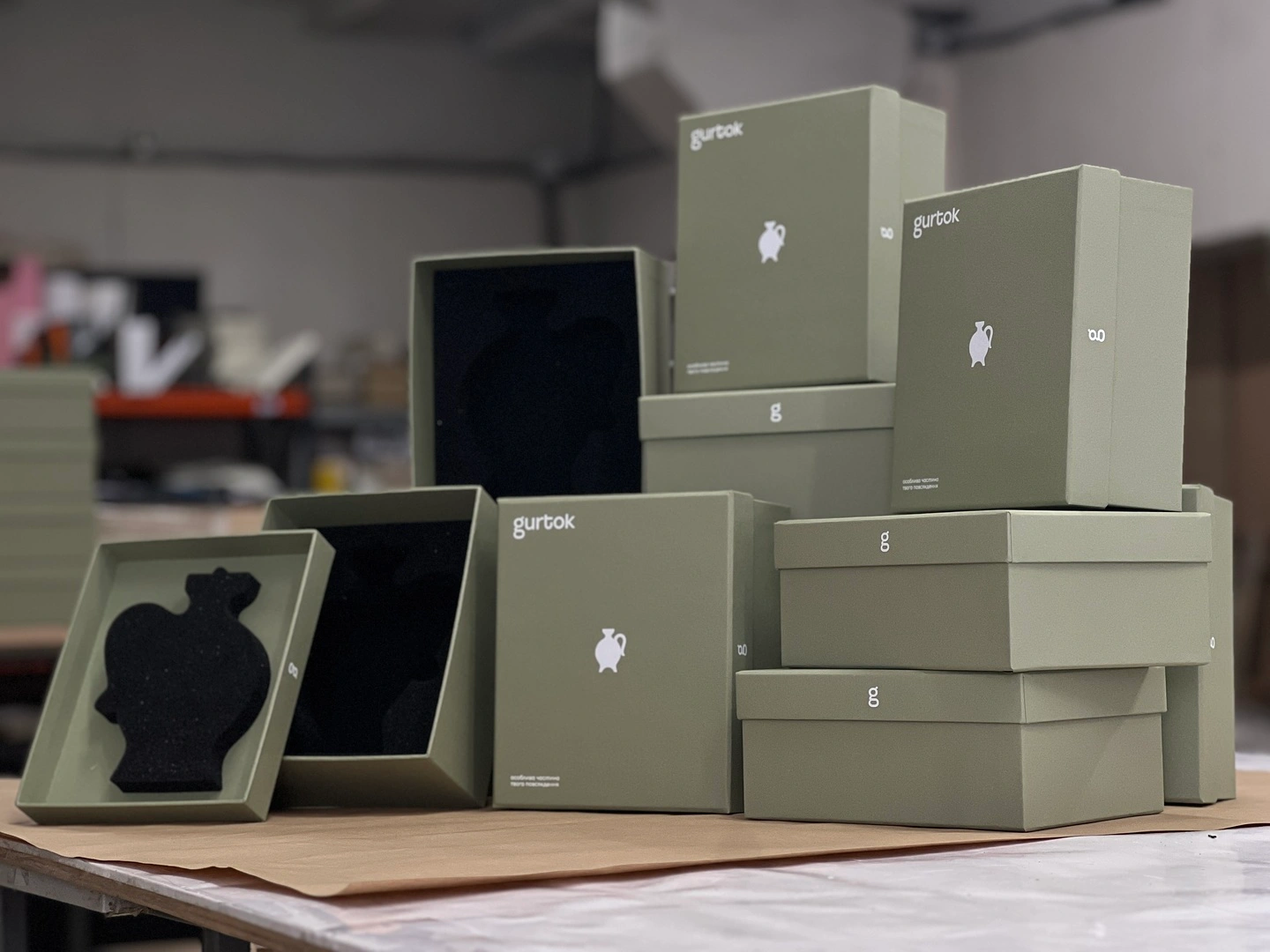 Olive candle boxes with Gurtok logo, custom made
