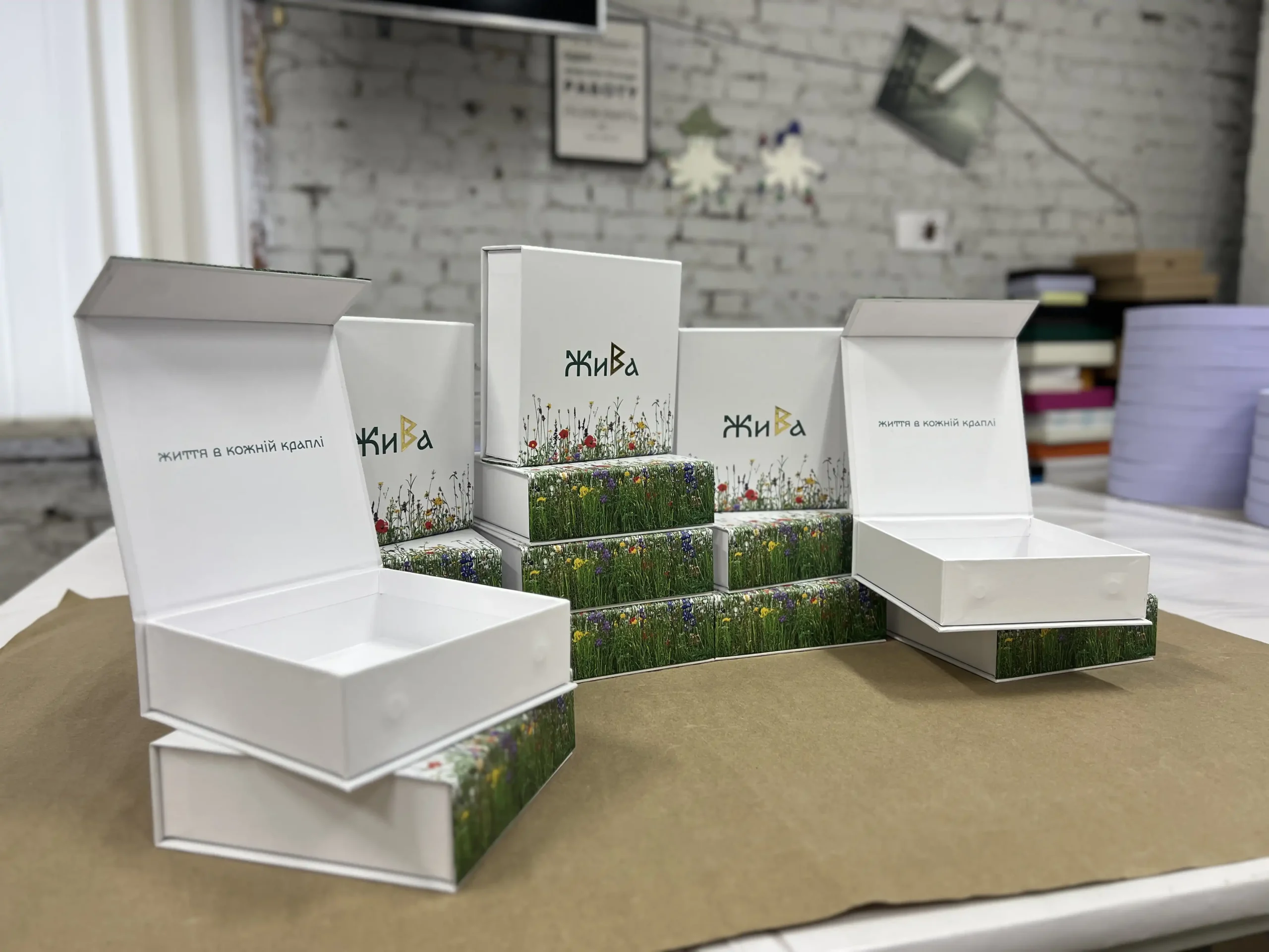 Production of secure packaging for Zhyva vials. Featuring durable cardboard, floral print, gold foil stamping, and protective matte lamination.